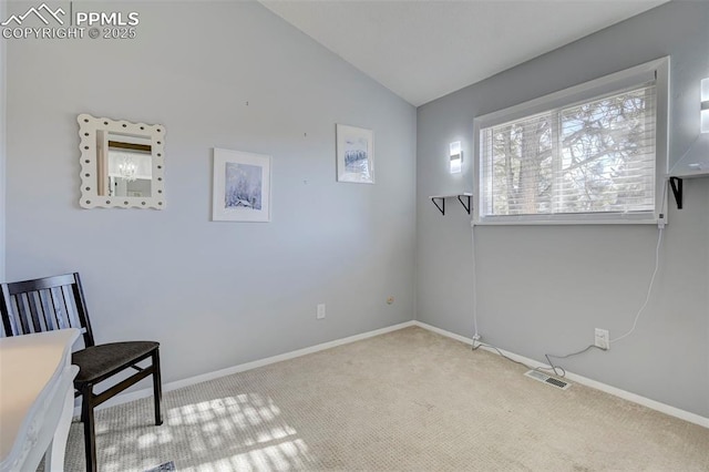 living area with light colored carpet and lofted ceiling