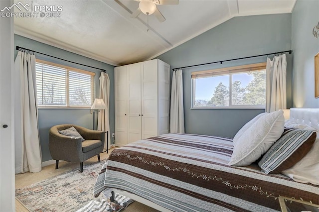 bedroom with lofted ceiling, carpet floors, and ceiling fan