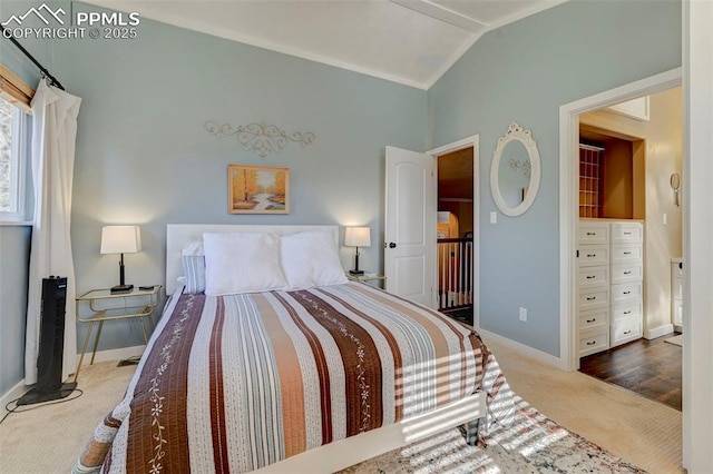 carpeted bedroom featuring vaulted ceiling