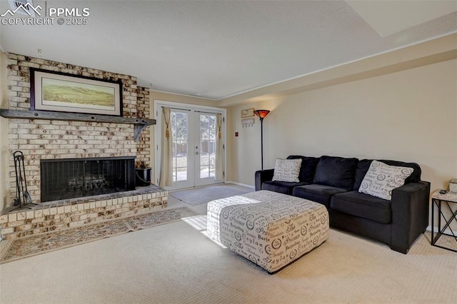 carpeted living room featuring french doors and a fireplace