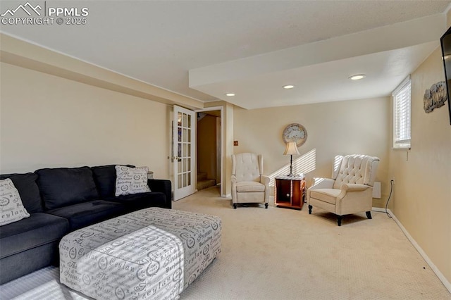 living room featuring carpet flooring and french doors