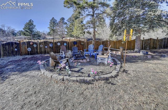 view of yard featuring an outdoor fire pit