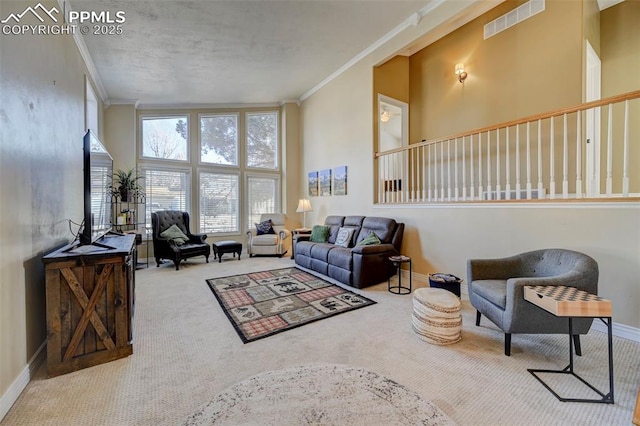 carpeted living room featuring a high ceiling and ornamental molding