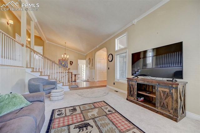 carpeted living room featuring crown molding, vaulted ceiling, and a chandelier