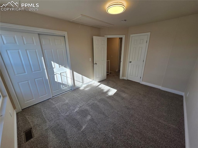 empty room featuring dark colored carpet