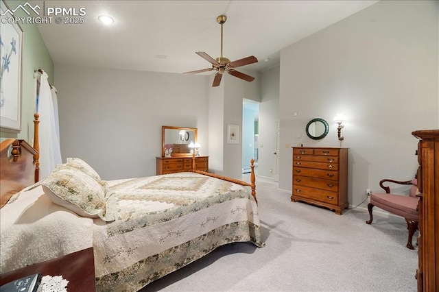 carpeted bedroom with baseboards, high vaulted ceiling, and ceiling fan