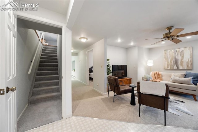 carpeted living area featuring stairway, recessed lighting, baseboards, and ceiling fan