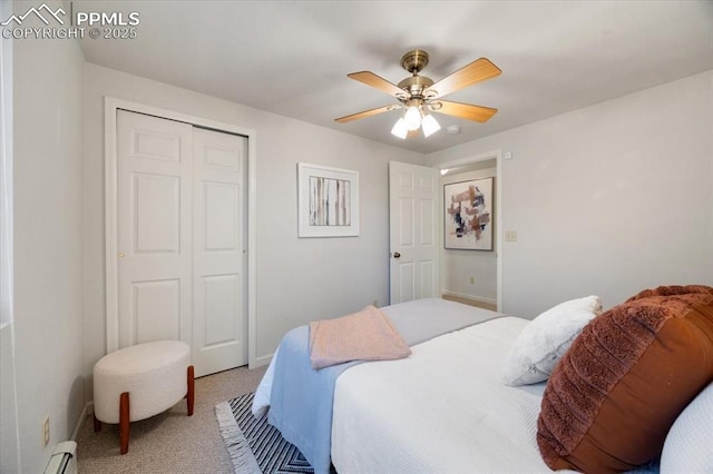 carpeted bedroom featuring baseboards, a closet, baseboard heating, and ceiling fan