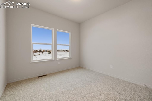 empty room featuring carpet flooring