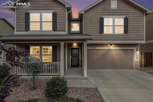 view of front of home with a garage and covered porch