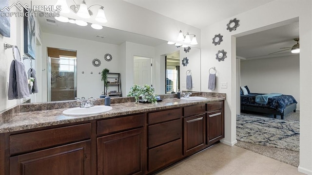 bathroom with ceiling fan, vanity, and tile patterned flooring