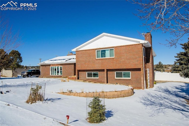 view of snow covered house