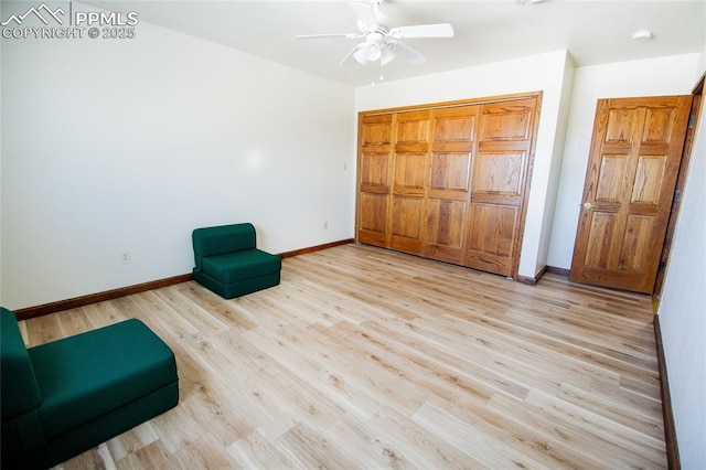 unfurnished room featuring ceiling fan and light wood-type flooring