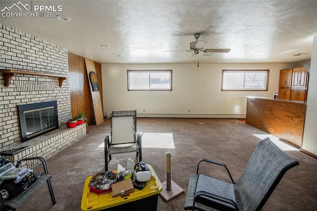 living room with carpet, plenty of natural light, baseboard heating, and a brick fireplace