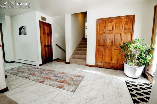 entrance foyer featuring a baseboard heating unit