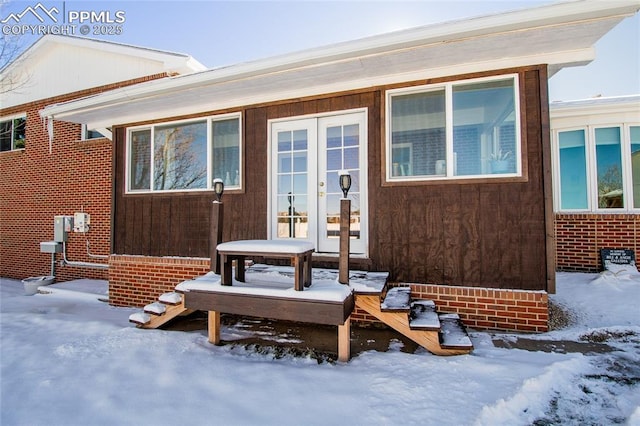 101 Welton Ave, Walsenburg, CO 81089 - snow covered property entrance with french doors and brick siding