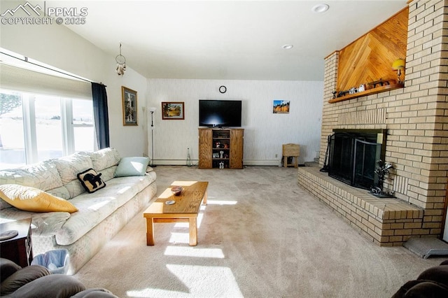 carpeted living room featuring a brick fireplace and baseboard heating