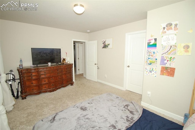 bedroom featuring light colored carpet