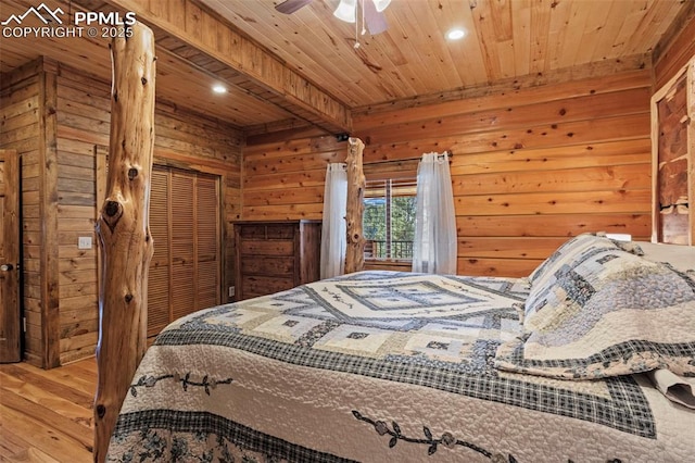 bedroom featuring wood ceiling, wood-type flooring, beam ceiling, and wood walls