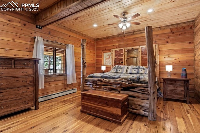 bedroom with wooden walls, wood ceiling, baseboard heating, beam ceiling, and light hardwood / wood-style flooring