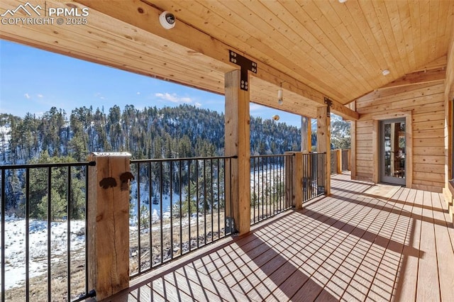 snow covered deck with a water view