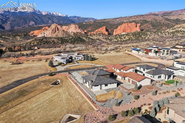 birds eye view of property featuring a mountain view