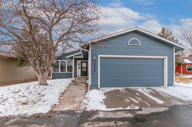 single story home featuring a garage