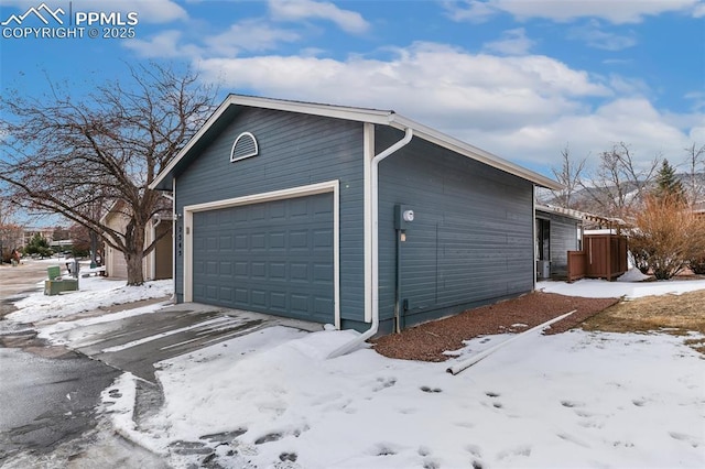 view of snow covered garage