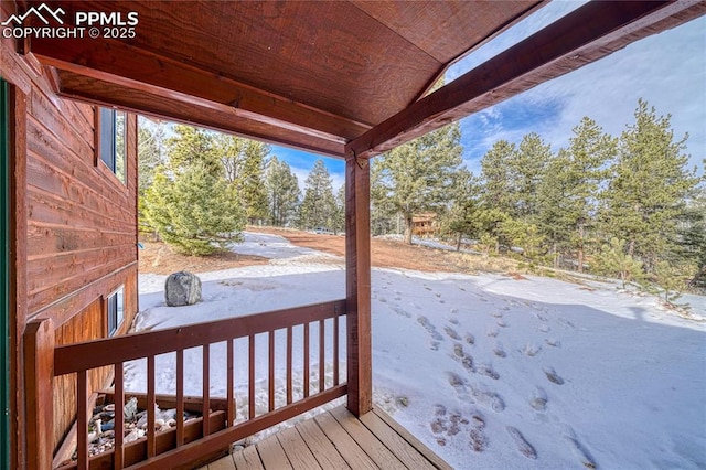 view of snow covered deck