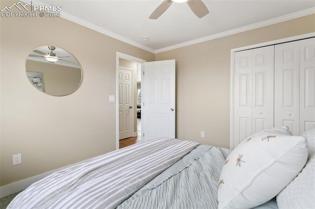 bedroom featuring ceiling fan, a closet, and crown molding