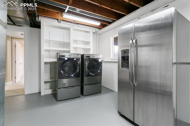 laundry area featuring washing machine and dryer