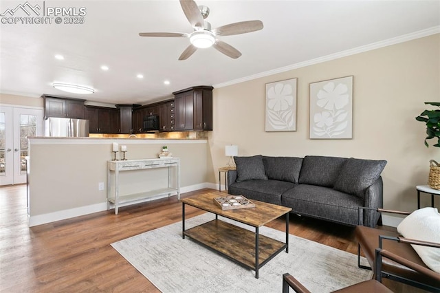 living room featuring ceiling fan, crown molding, french doors, and dark hardwood / wood-style floors