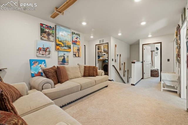 living room with light carpet, visible vents, and recessed lighting