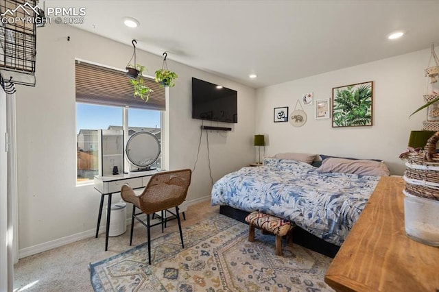 bedroom featuring light carpet, baseboards, and recessed lighting