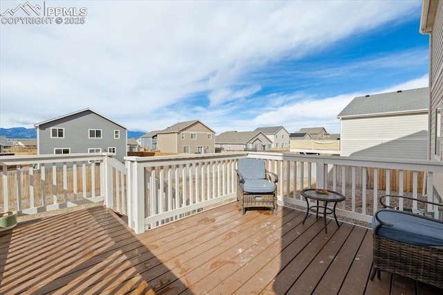 wooden terrace with a residential view