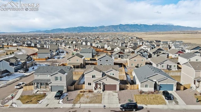 drone / aerial view with a mountain view and a residential view