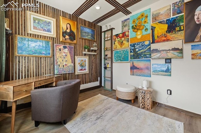 living area featuring wood finished floors and baseboards