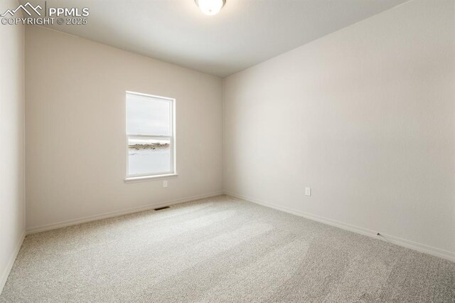 empty room featuring carpet floors