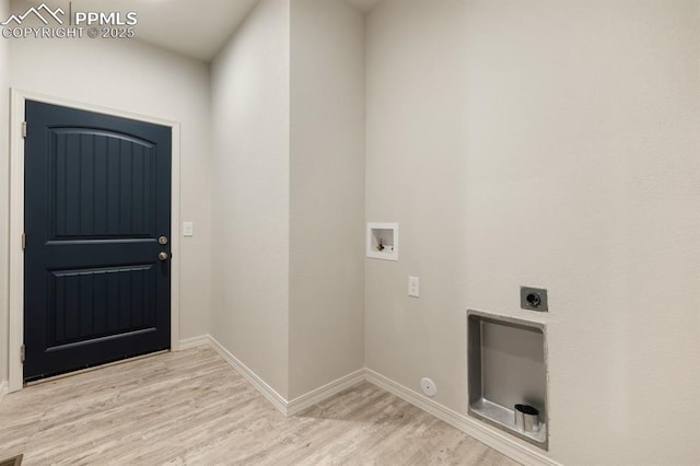 clothes washing area featuring hookup for an electric dryer, washer hookup, and light hardwood / wood-style floors