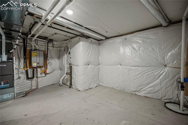 basement featuring tankless water heater