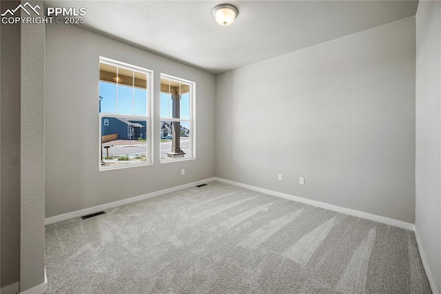 view of carpeted spare room