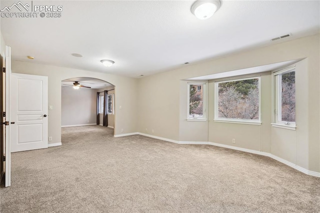 spare room with ceiling fan and carpet floors