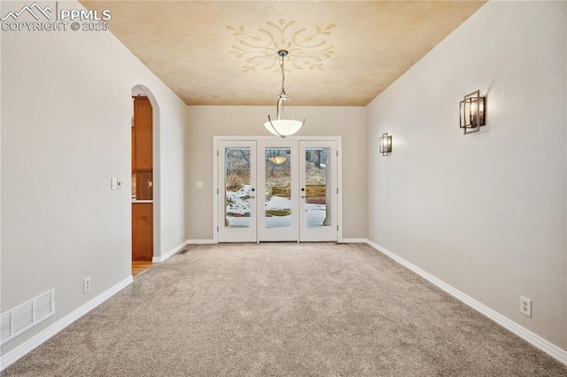 unfurnished dining area with carpet