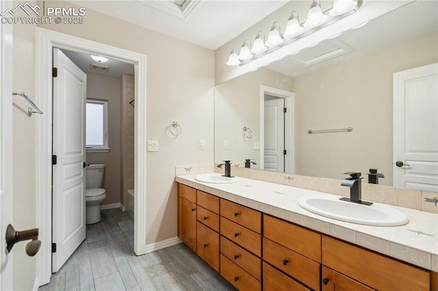 full bathroom with vanity, bathing tub / shower combination, hardwood / wood-style floors, and toilet