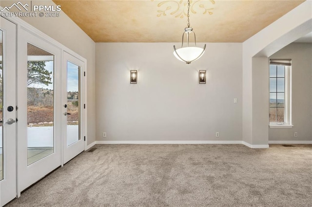 unfurnished dining area with carpet flooring