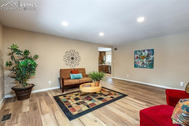 living area featuring hardwood / wood-style flooring