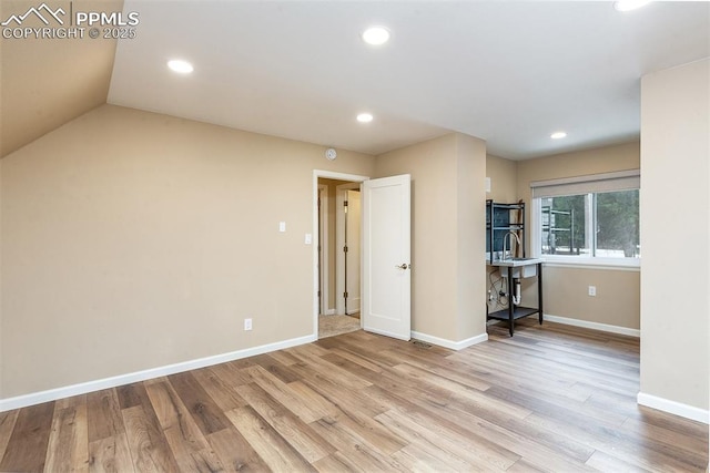 spare room with light hardwood / wood-style floors