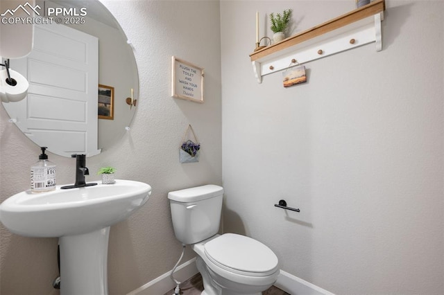 bathroom with sink and toilet