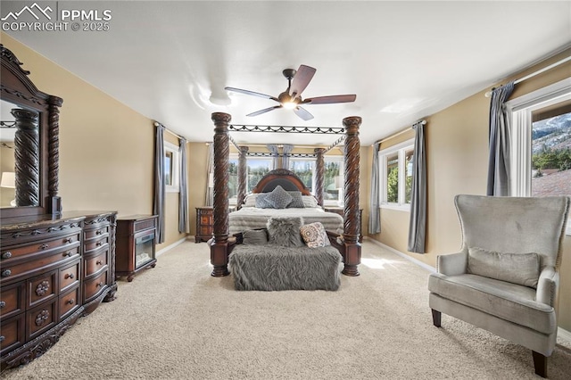 bedroom with ceiling fan and light carpet