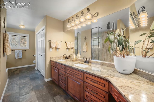 bathroom featuring vanity, toilet, and tiled shower